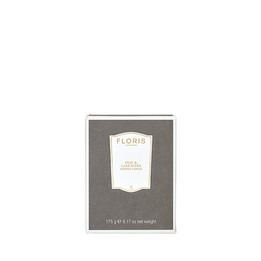 A gray Floris London Oud & Cashmere Scented Candle 175g, with white trim and gold-accented label—perfect to elevate your home fragrance collection.