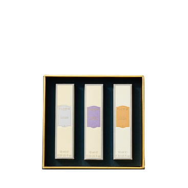 A gold box with three labeled floral perfumes from Floris London—Perfumer's Trilogy: For Her—delicate fragrances arranged for her enjoyment.