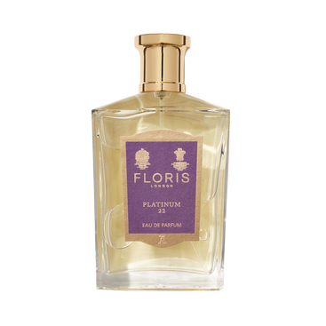 Clear glass bottle of Floris London's Platinum 22 - Eau de Parfum, a vegan fragrance, with a gold cap and purple label.