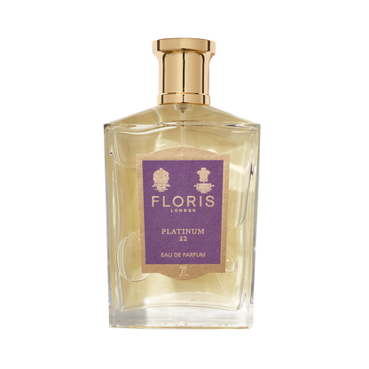 Clear glass bottle of Floris London's Platinum 22 - Eau de Parfum, a vegan fragrance, with a gold cap and purple label.