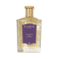 A clear glass bottle of Platinum 22 - Eau de Parfum by Floris London, featuring a gold cap and purple label—an elegant vegan fragrance.