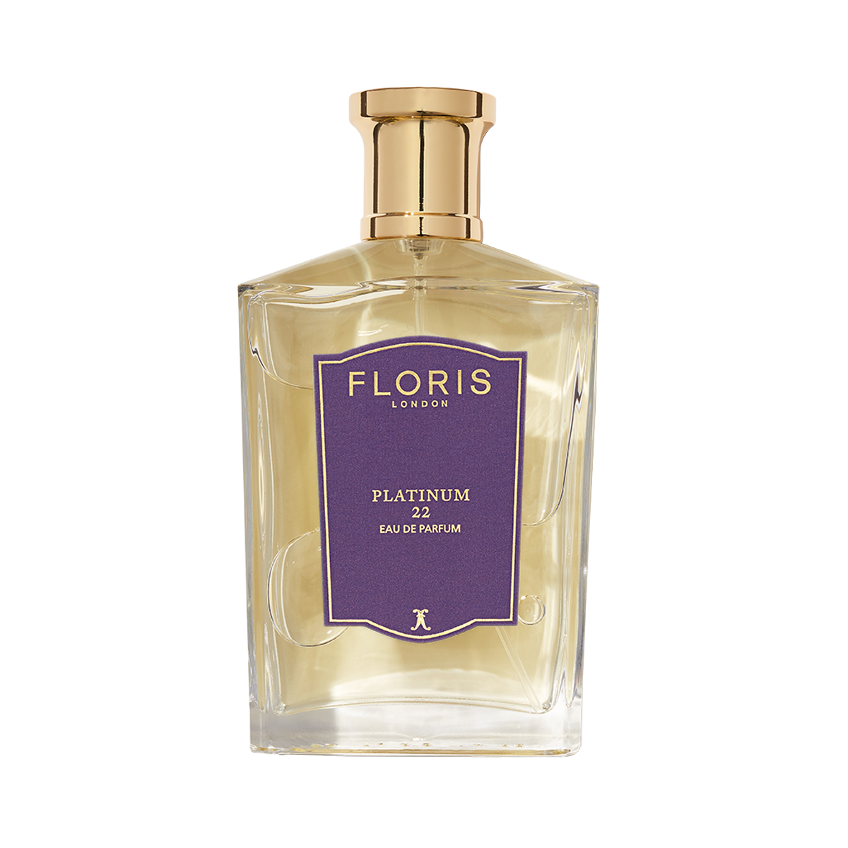 A clear glass bottle of Platinum 22 - Eau de Parfum by Floris London, featuring a gold cap and purple label—an elegant vegan fragrance.