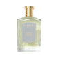 A clear bottle of Floris London UK Purple Mémoire Eau de Parfum, featuring English charm with a gold cap and light blue label.