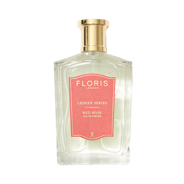 A clear bottle with a gold cap labeled "Floris London UK Red Rose Eau de Parfum," featuring elegant notes of Rose Absolute.