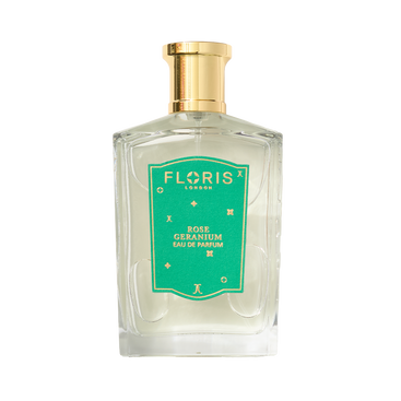 A clear glass bottle of Floris London UK Rose Geranium | Limited Edition Eau de Parfum with a gold cap and green label.