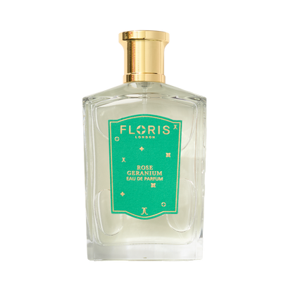 A clear glass bottle of Floris London UK Rose Geranium | Limited Edition Eau de Parfum with a gold cap and green label.