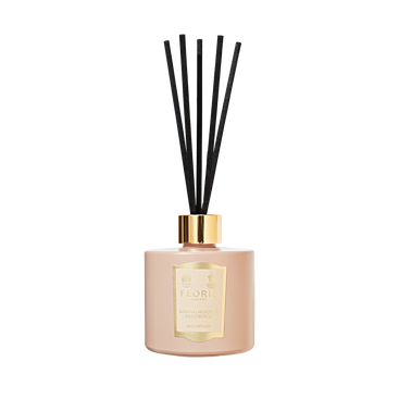 Elegant Floris London diffuser with a gold label and black reeds, infused with rich sandalwood and patchouli.