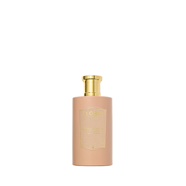 A beige Floris London Sandalwood & Patchouli bottle with a golden cap sits elegantly against a white backdrop, exuding rose and sandalwood hints.