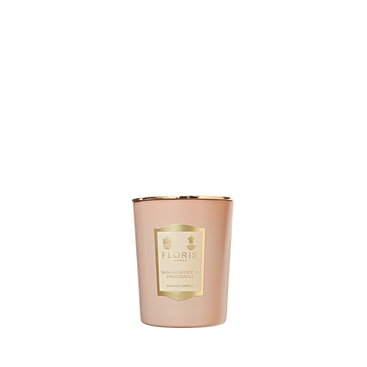 Floris London's pink candle, 175g, with sandalwood and patchouli notes, comes with a gold label.