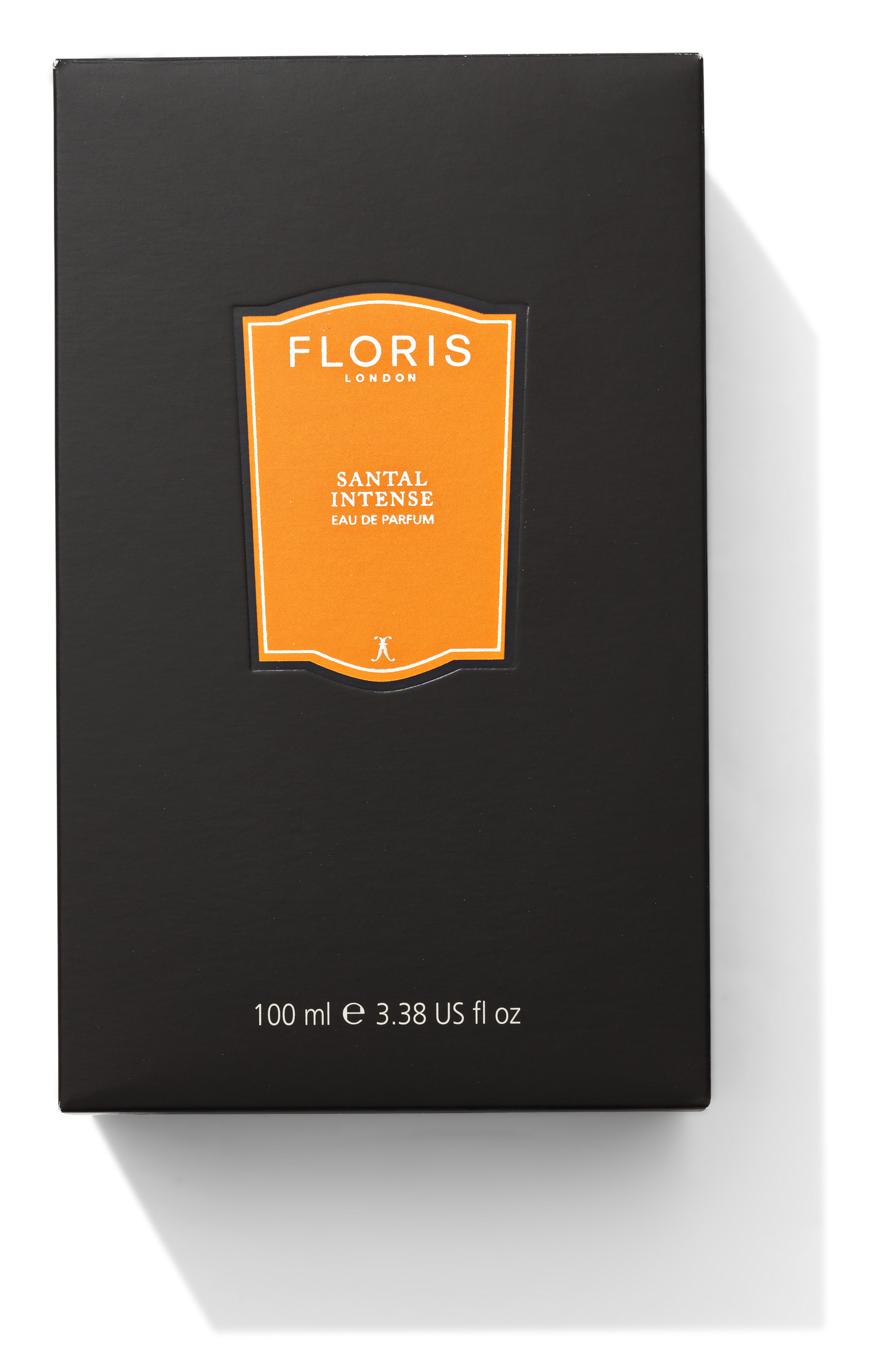 a large black box with a bright orange label. It says 100ml and Santal Intense on it.