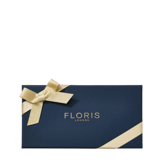 The Floris London Soap Collection comes in a navy gift box with "Floris London" and adorned with a gold ribbon and bow.
