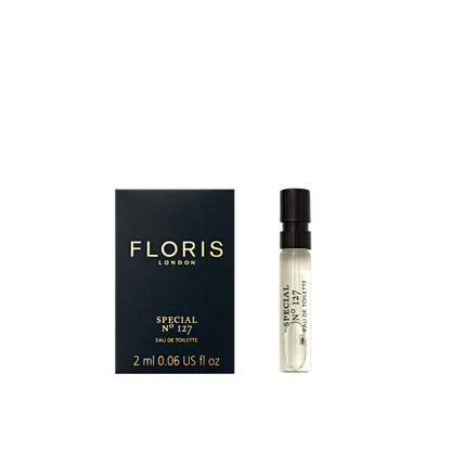 Floris London's Special No. 127 Eau de Toilette, in a 2ml spray, with bergamot and lavender hints, embodies historic elegance beside its dark blue box.
