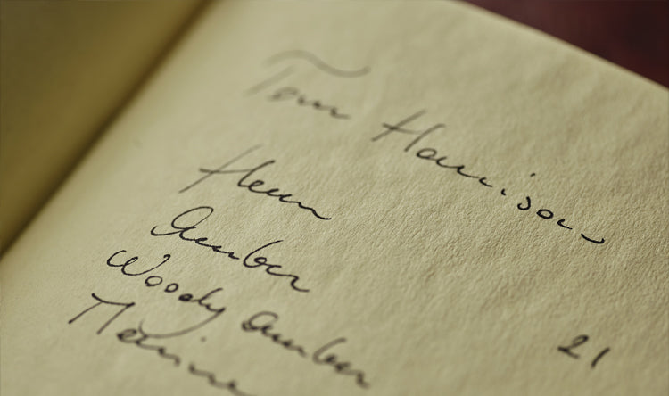 A white Floris London ledger book with fragrance notes and accords written in it