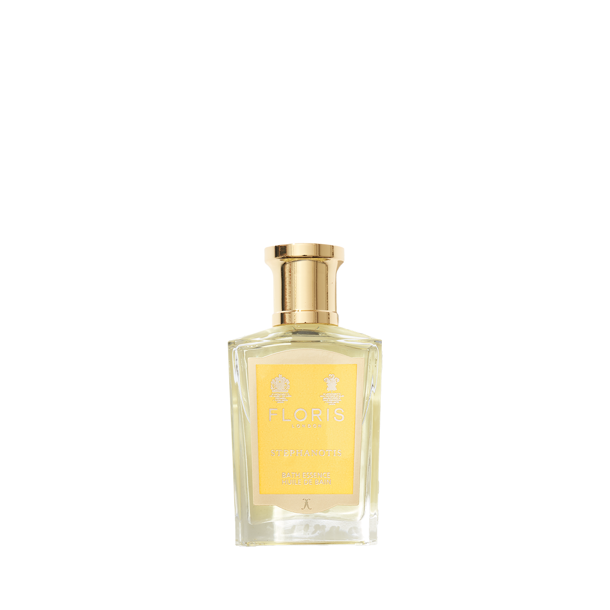 Clear glass bottle with gold cap containing Floris London Stephanotis - Bath Essence, featuring a floral fragrance and a yellow label.