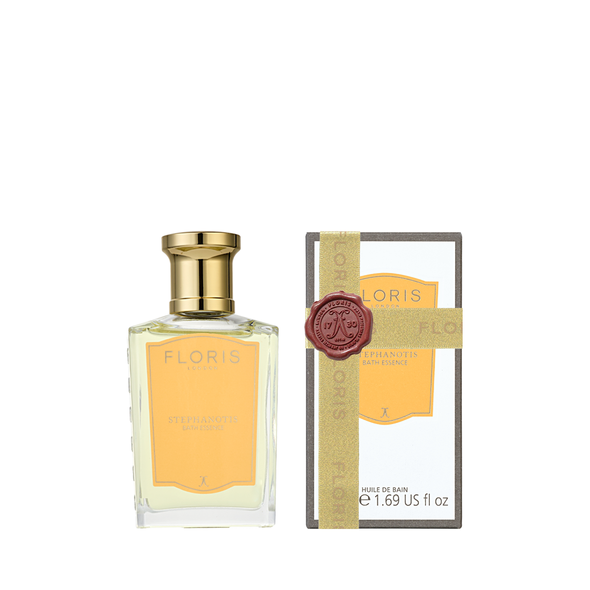 A glass bottle of Floris London Stephanotis - Bath Essence with a gold cap next to its tall, rectangular box featuring a decorative red wax seal.