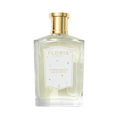 A clear glass bottle of Floris London UK Stephanotis | Limited Edition perfume, with a gold cap, white label, and a delicate floral scent.