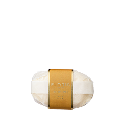 Floris London's Stephanotis Soap, paper-wrapped with a gold label, is crafted from a vegetable base and enriched with shea butter.