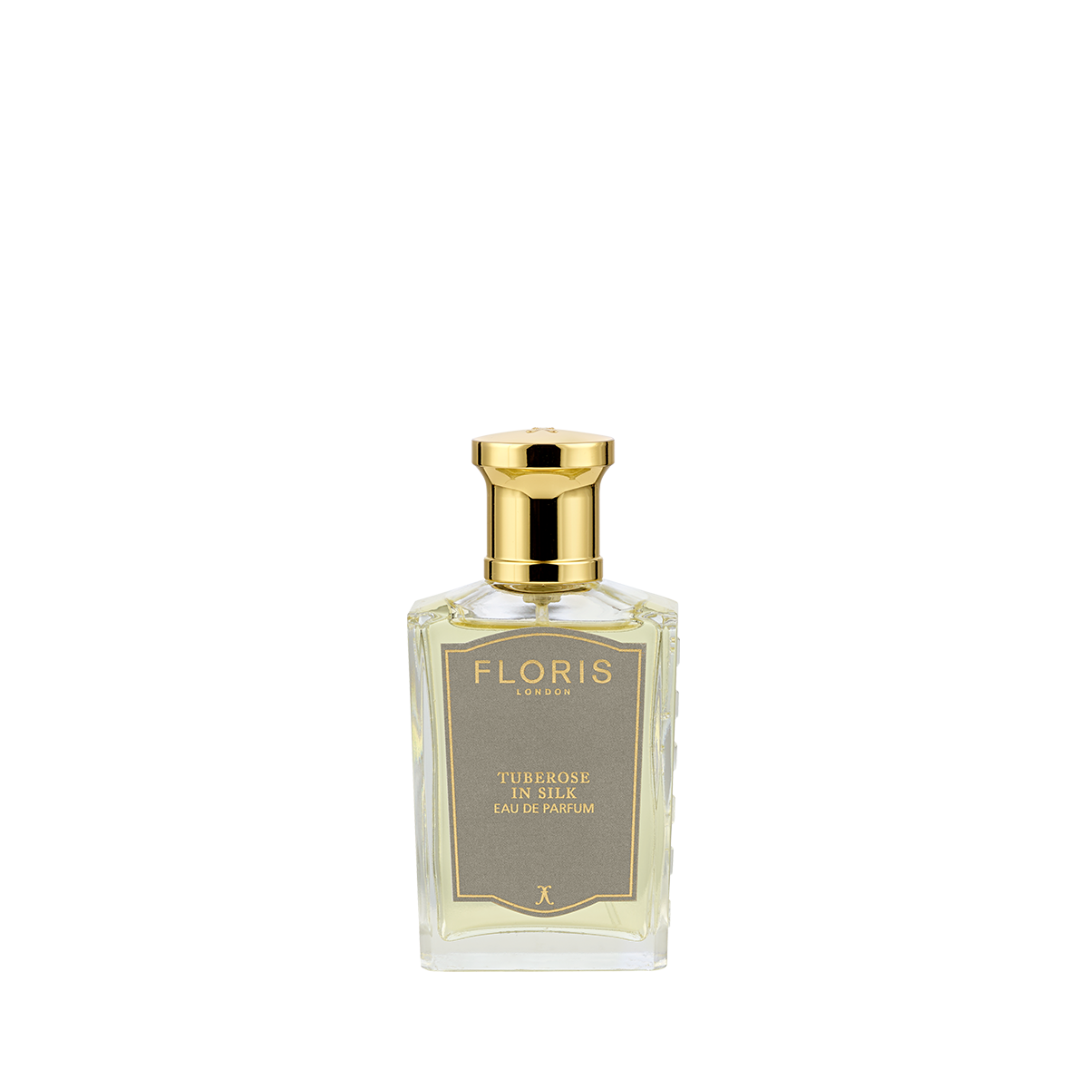 A clear glass bottle of Floris London Tuberose in Silk Eau de Parfum, a floral scent with a gold cap and label.