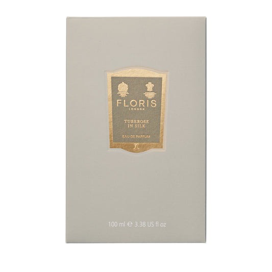 A beige box of Floris London's "Tuberose in Silk" Eau de Parfum, 100 ml, reveals a captivating fragrance with hints of jasmine.