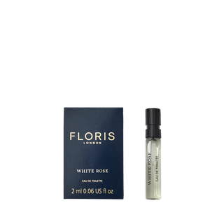 Floris London's White Rose Eau de Toilette, 2ml sample with velvet rose notes, beautifully set next to a chic blue box.