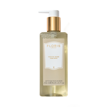 A 250ml bottle of Floris London White Rose Luxury Hand Wash with a hint of coconut and a gold pump.