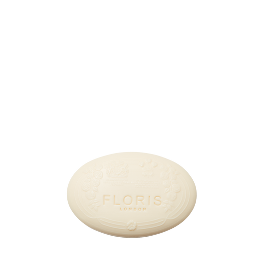Oval-shaped White Rose Soap by Floris London, embossed with brand text and enriched with shea butter for a creamy lather.