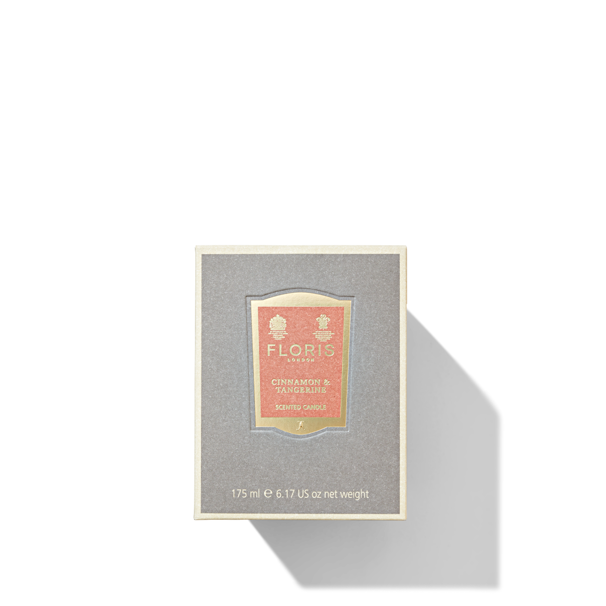 Grey candle box with orange label