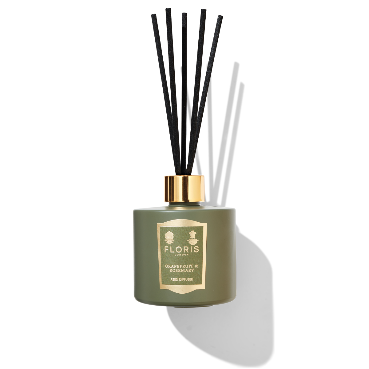 green diffuser glass with black reeds 