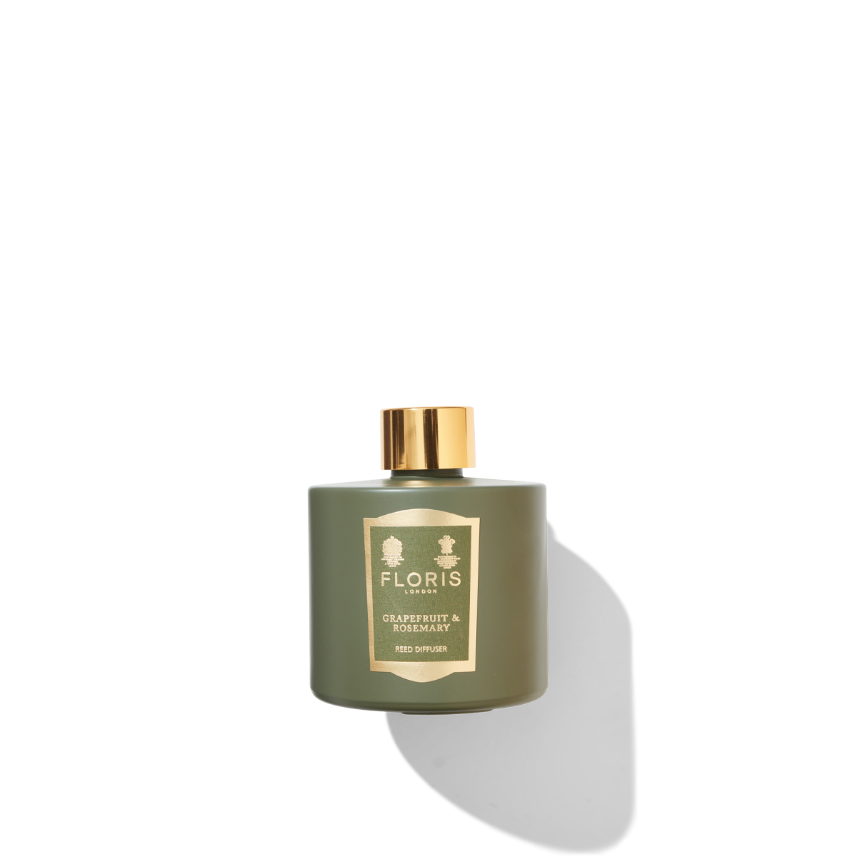 green diffuser bottle with grapefruit and rosemary scent label