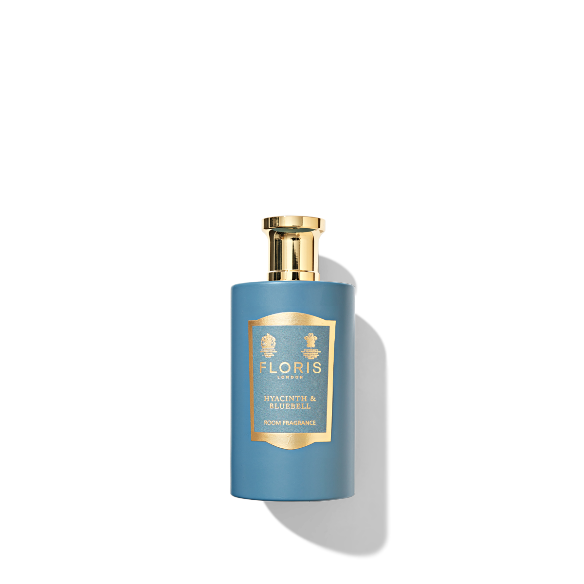 blue and gold glass bottle with hyacinth & bluebell label